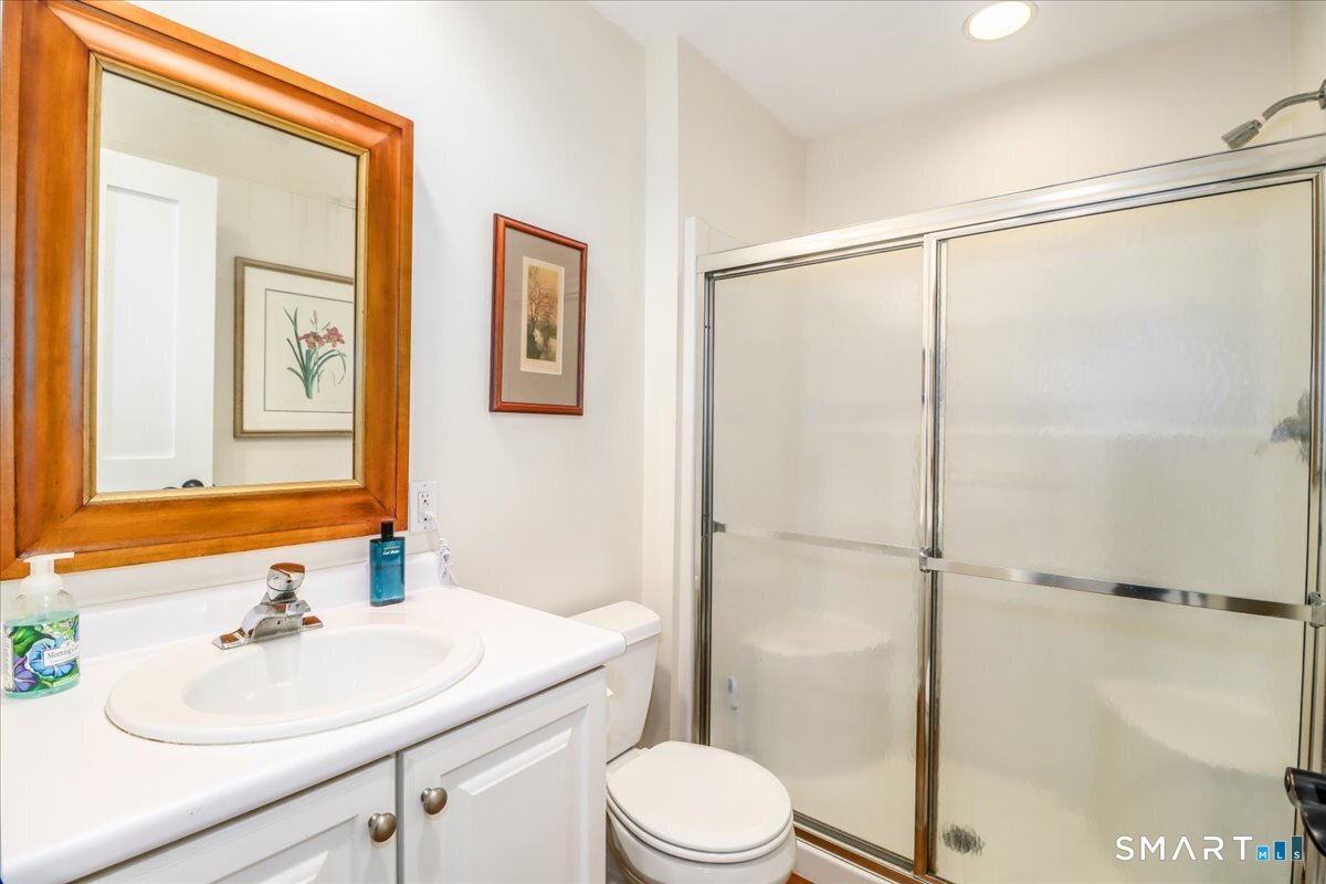 55 Washington Ridge Road New Milford, CT 06776 - Photo 35 of 40 a bathroom with a sink vanity mirror and toilet