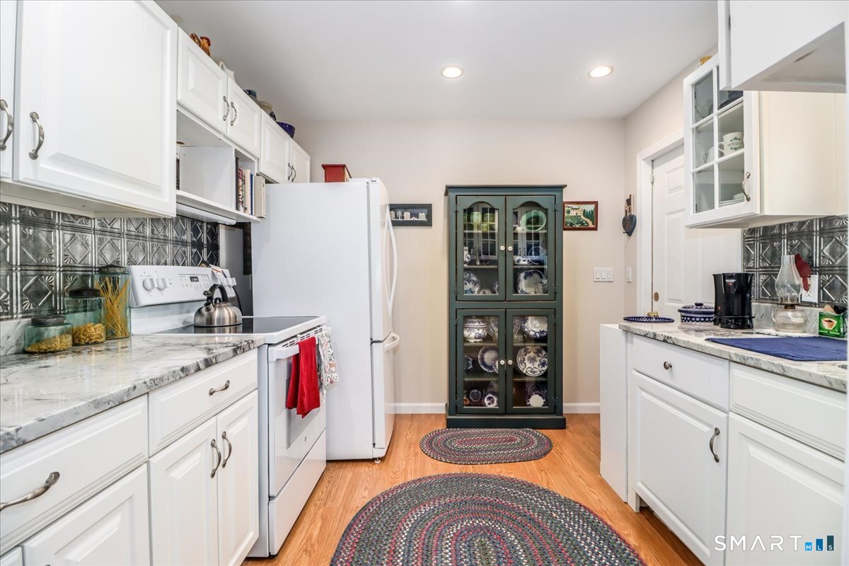 55 Washington Ridge Road New Milford, CT 06776 - Photo 37 of 40 a kitchen with stainless steel appliances granite countertop a sink and cabinets