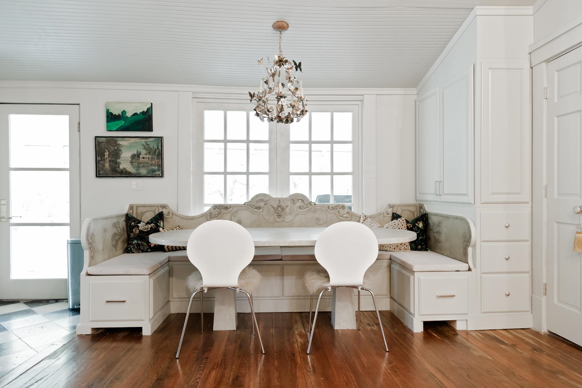 232 West Poplar Avenue Collierville, TN 38017 - Photo 13 of 36 Breakfast room with hanging lights, banquette table, storage and wood finished floors