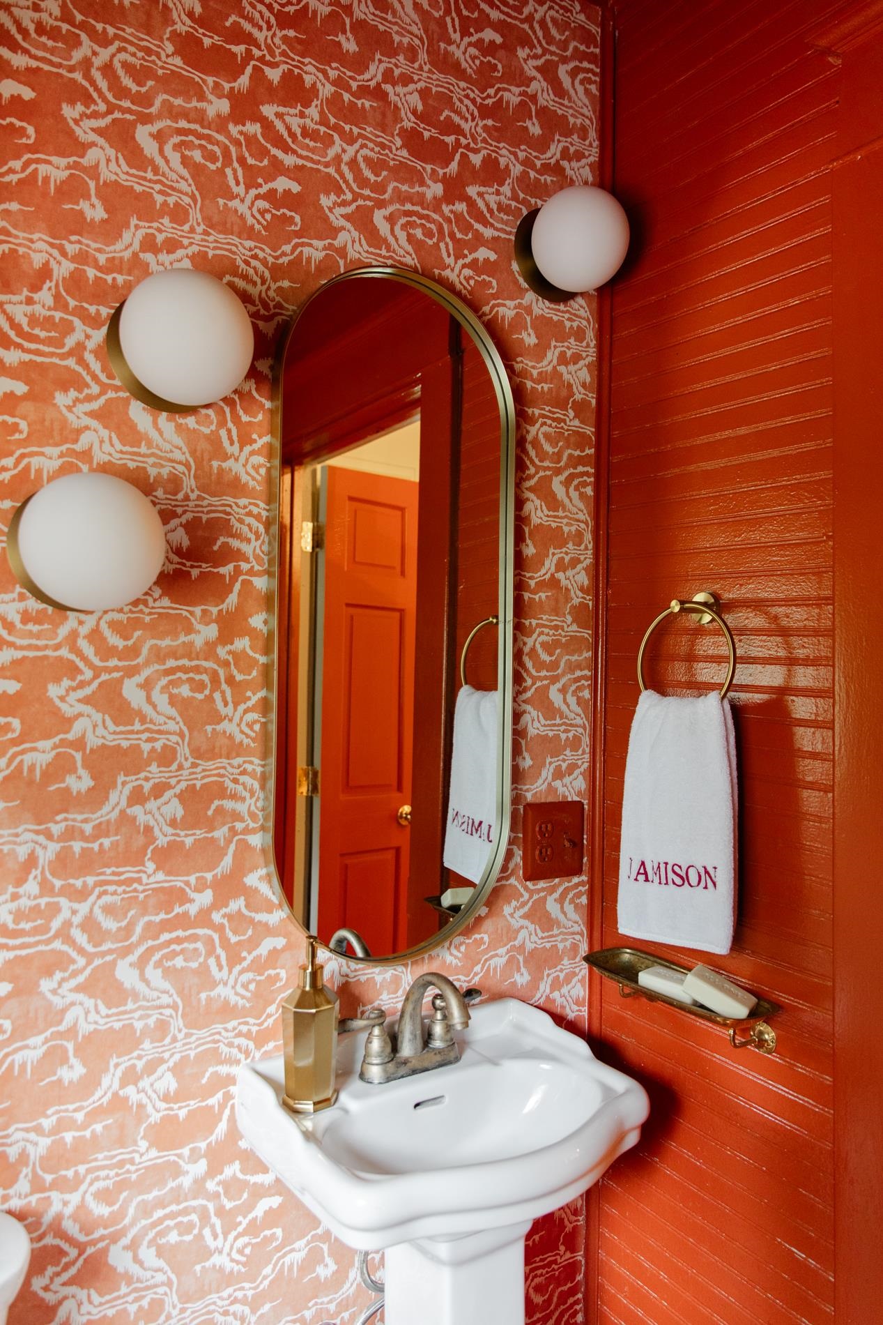 232 West Poplar Avenue Collierville, TN 38017 - Photo 19 of 36 Bathroom featuring wallpapered walls and a sink