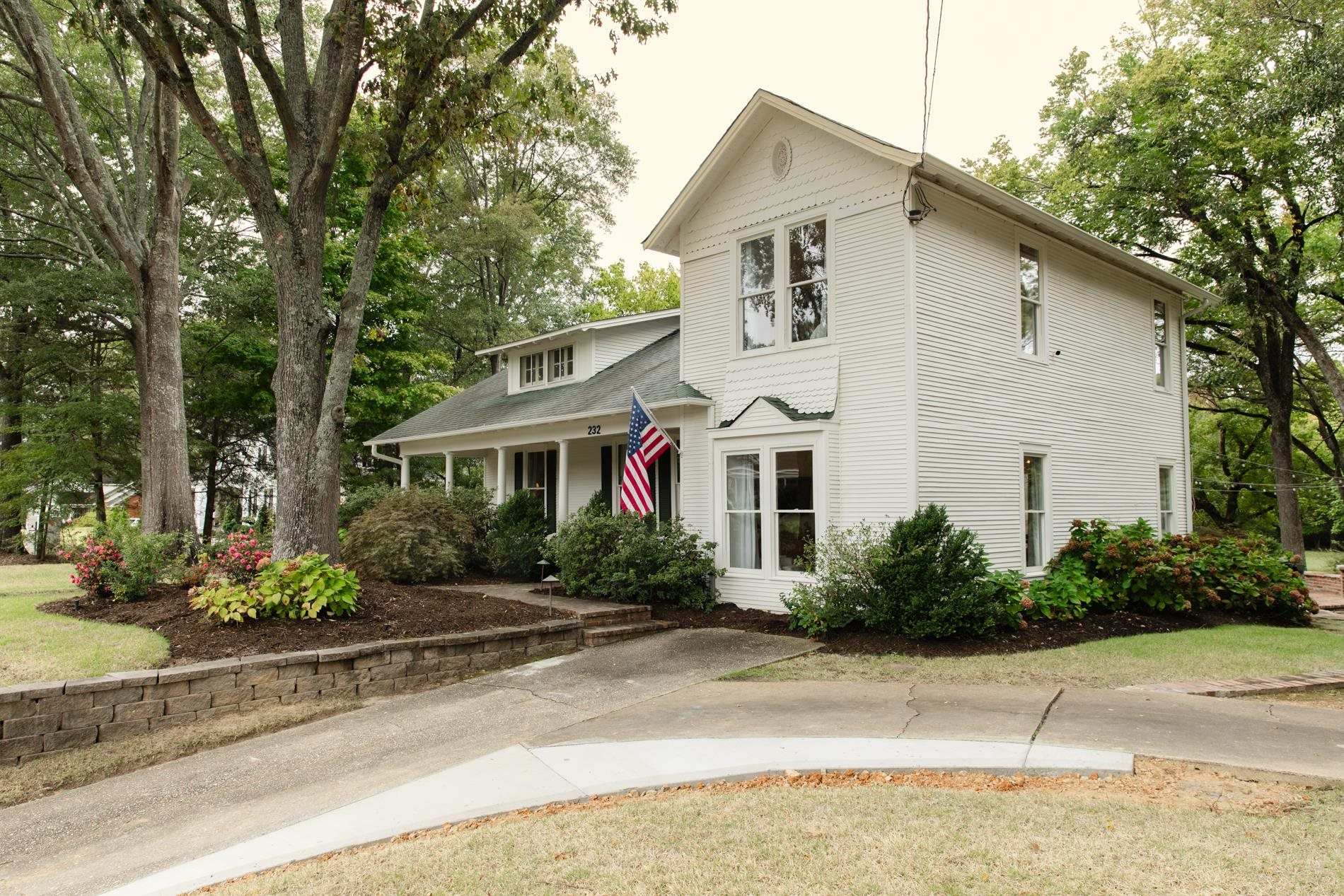 232 West Poplar Avenue Collierville, TN 38017 - Photo 2 of 36 View of front of house with covered porch