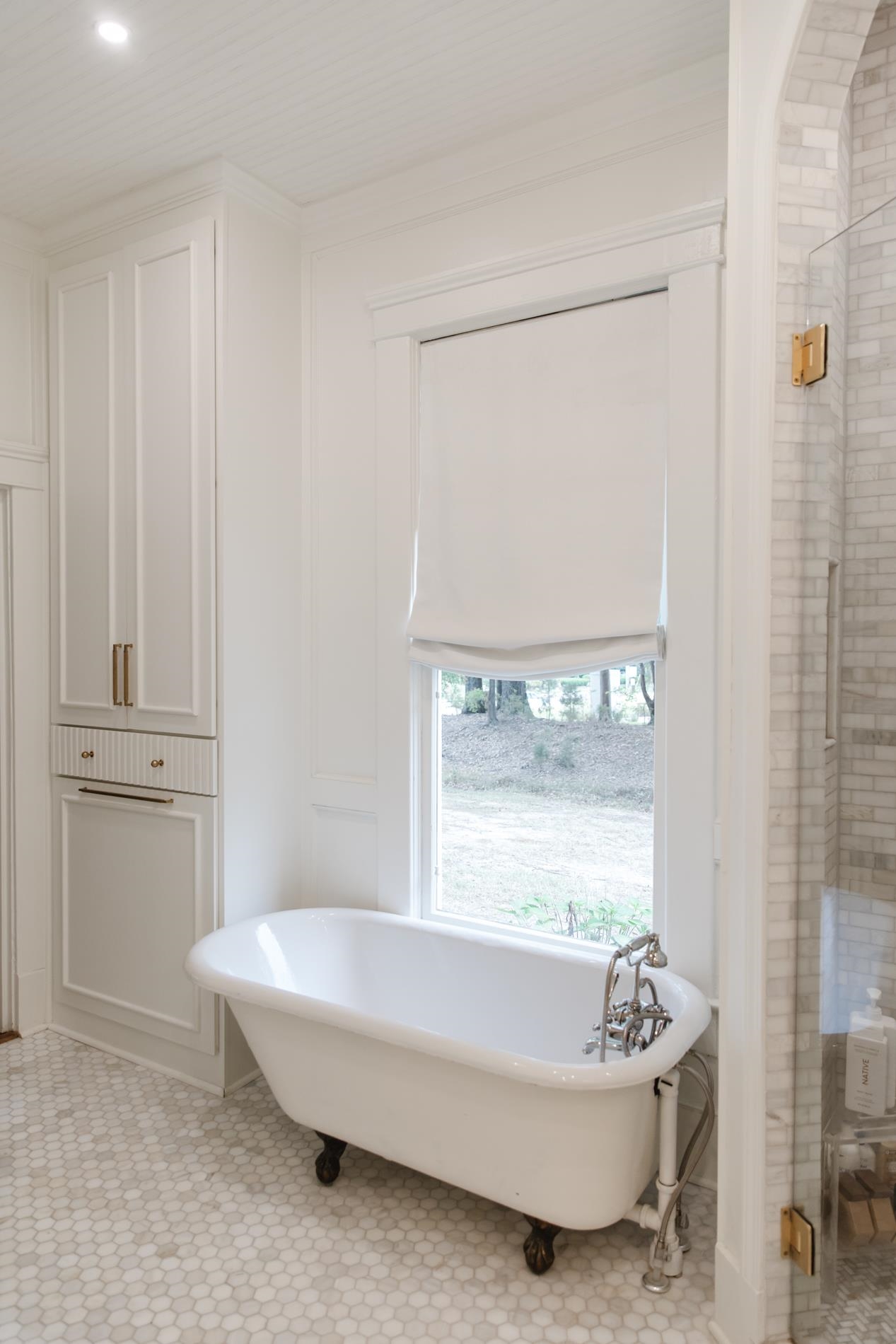 232 West Poplar Avenue Collierville, TN 38017 - Photo 31 of 36 Bathroom with a freestanding tub and a shower stall
