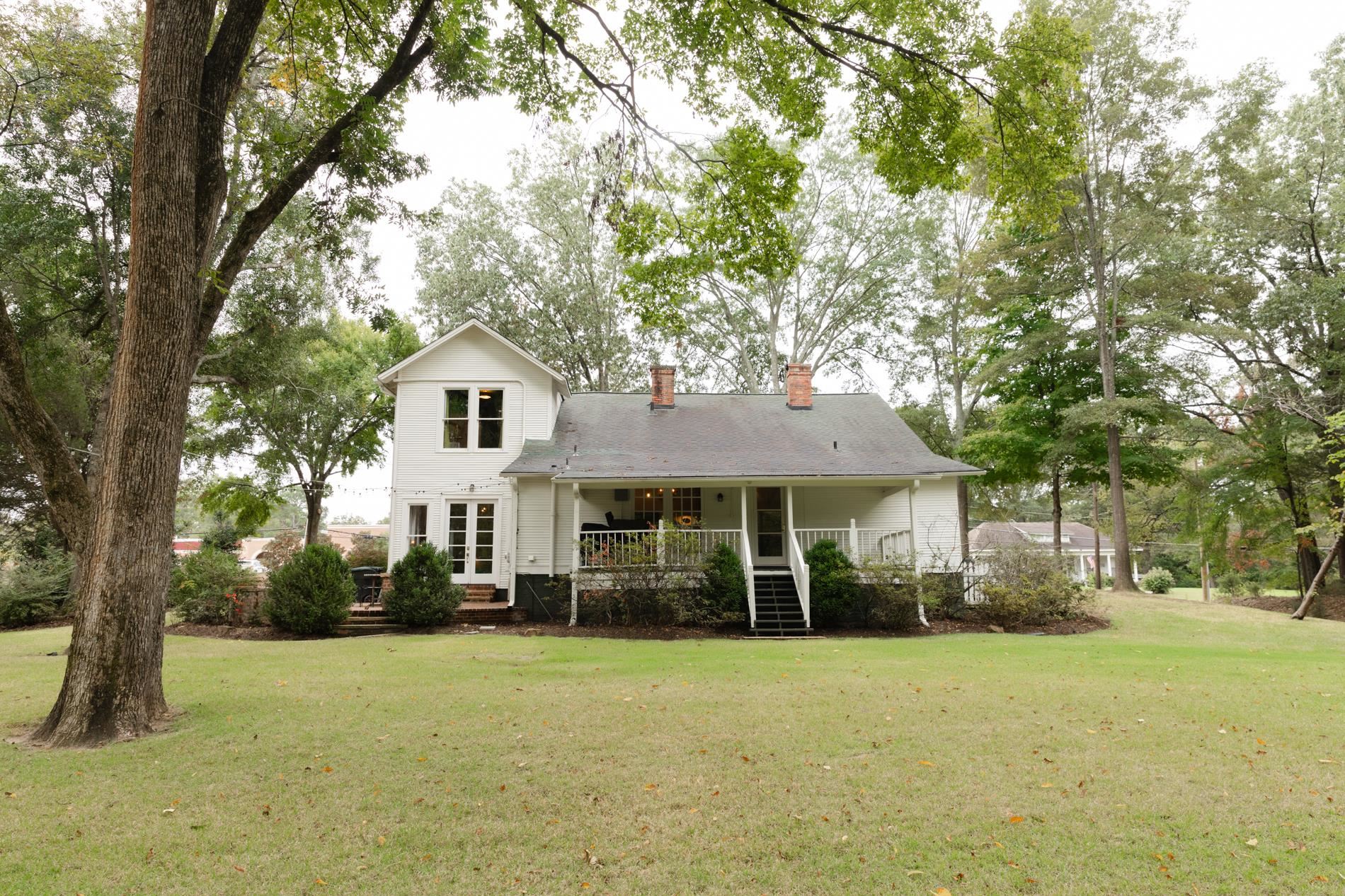 232 West Poplar Avenue Collierville, TN 38017 - Photo 36 of 36 Back of house with a yard, a porch, a chimney, and french doors