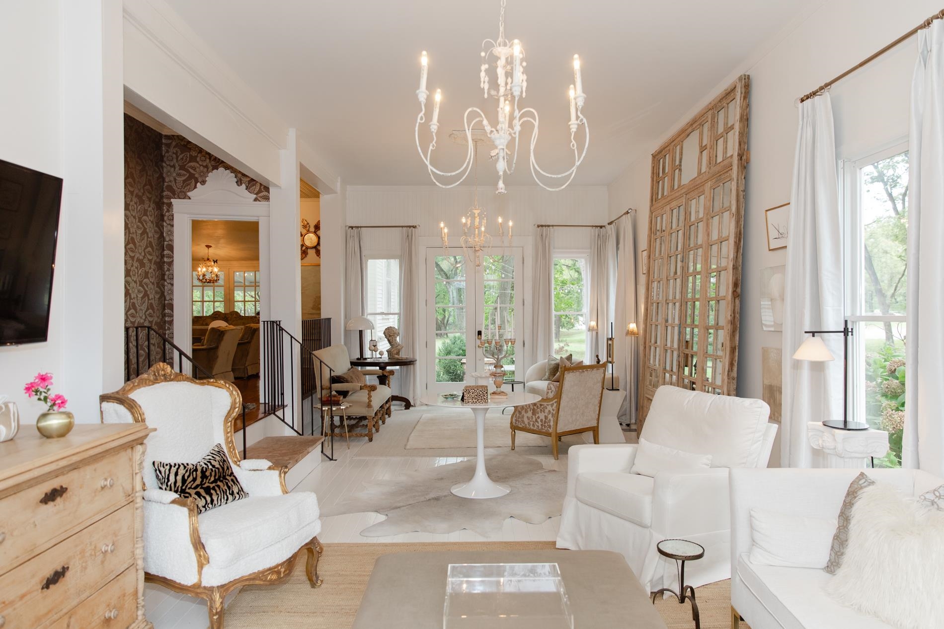 232 West Poplar Avenue Collierville, TN 38017 - Photo 5 of 36 Great room featuring suspended lighting, tons of space, wood flooring. natural light