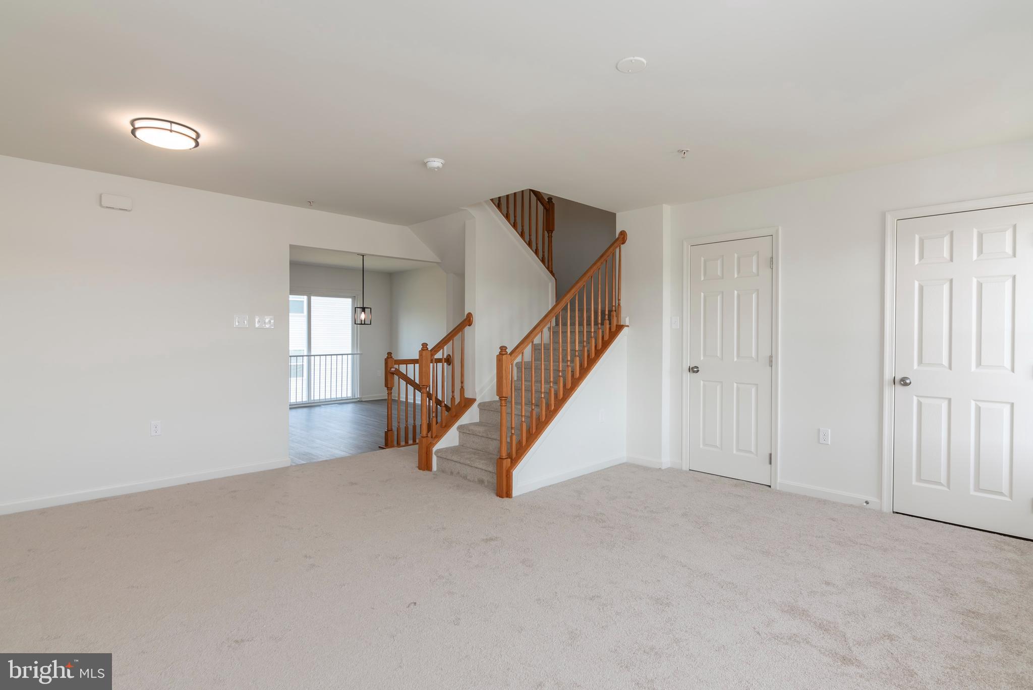 1533 Global Circle Cambridge, MD 21613 - Photo 16 of 27 a view of an empty room with stairs