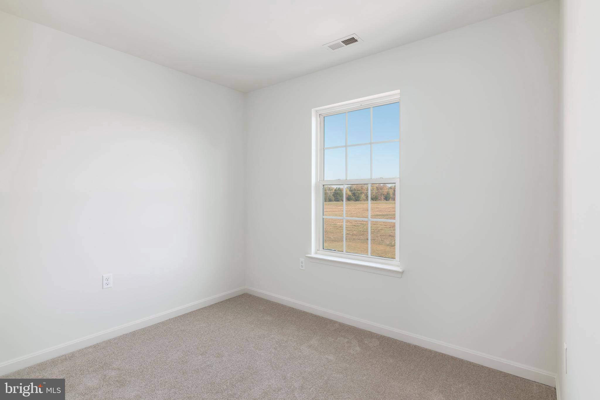 1533 Global Circle Cambridge, MD 21613 - Photo 18 of 27 an empty room with a window