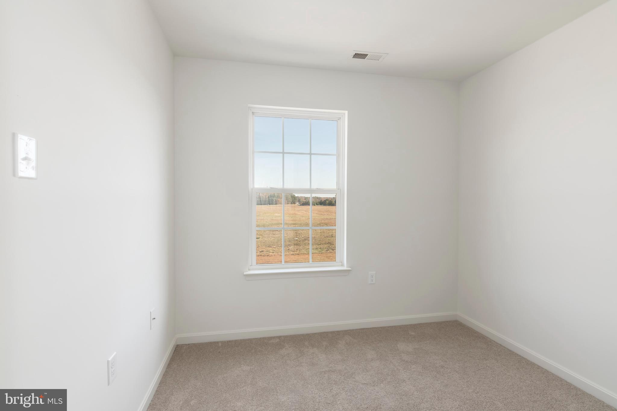 1533 Global Circle Cambridge, MD 21613 - Photo 19 of 27 an empty room with a window