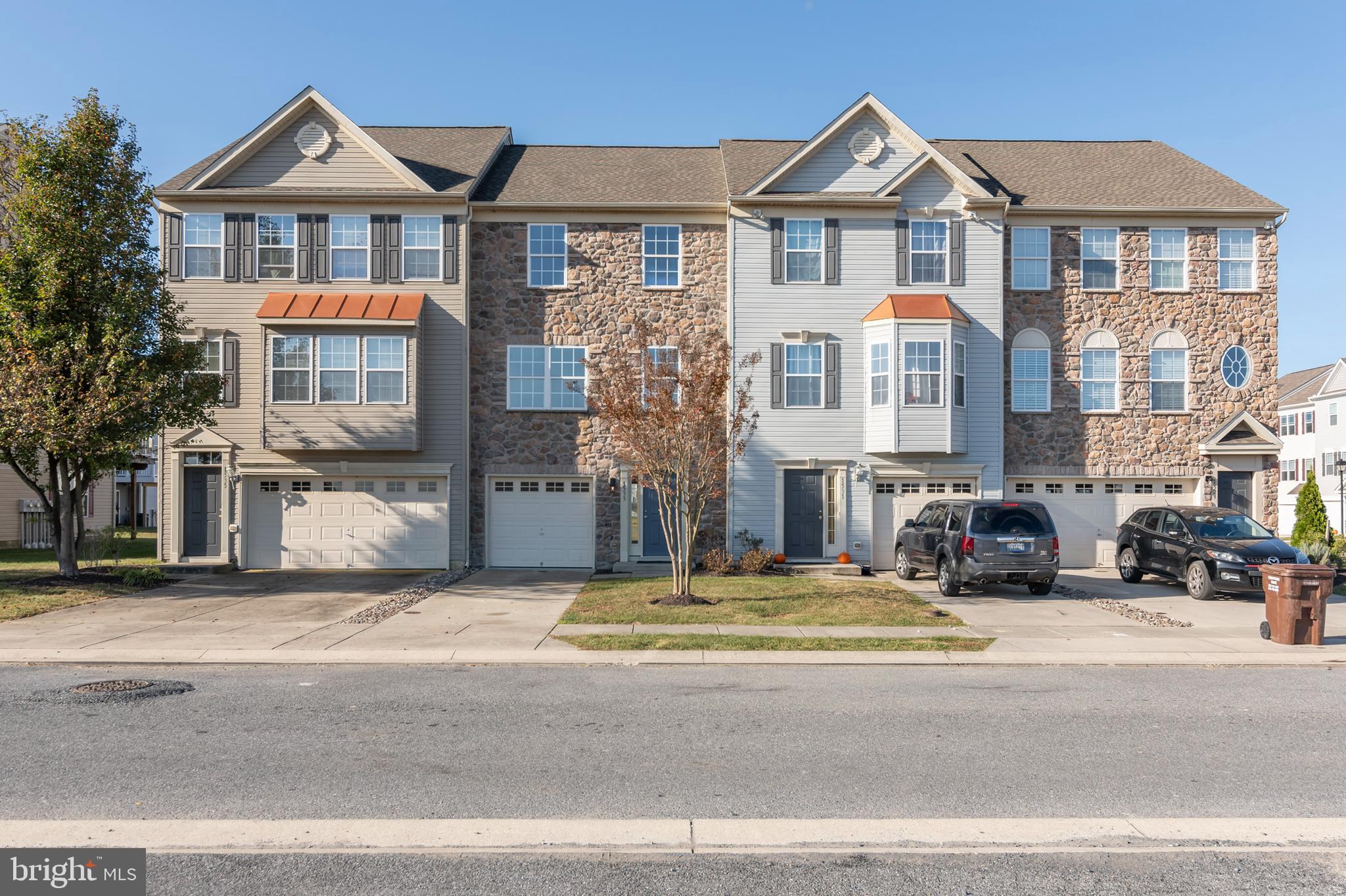 1533 Global Circle Cambridge, MD 21613 - Photo 2 of 27 a view of multiple houses with a street