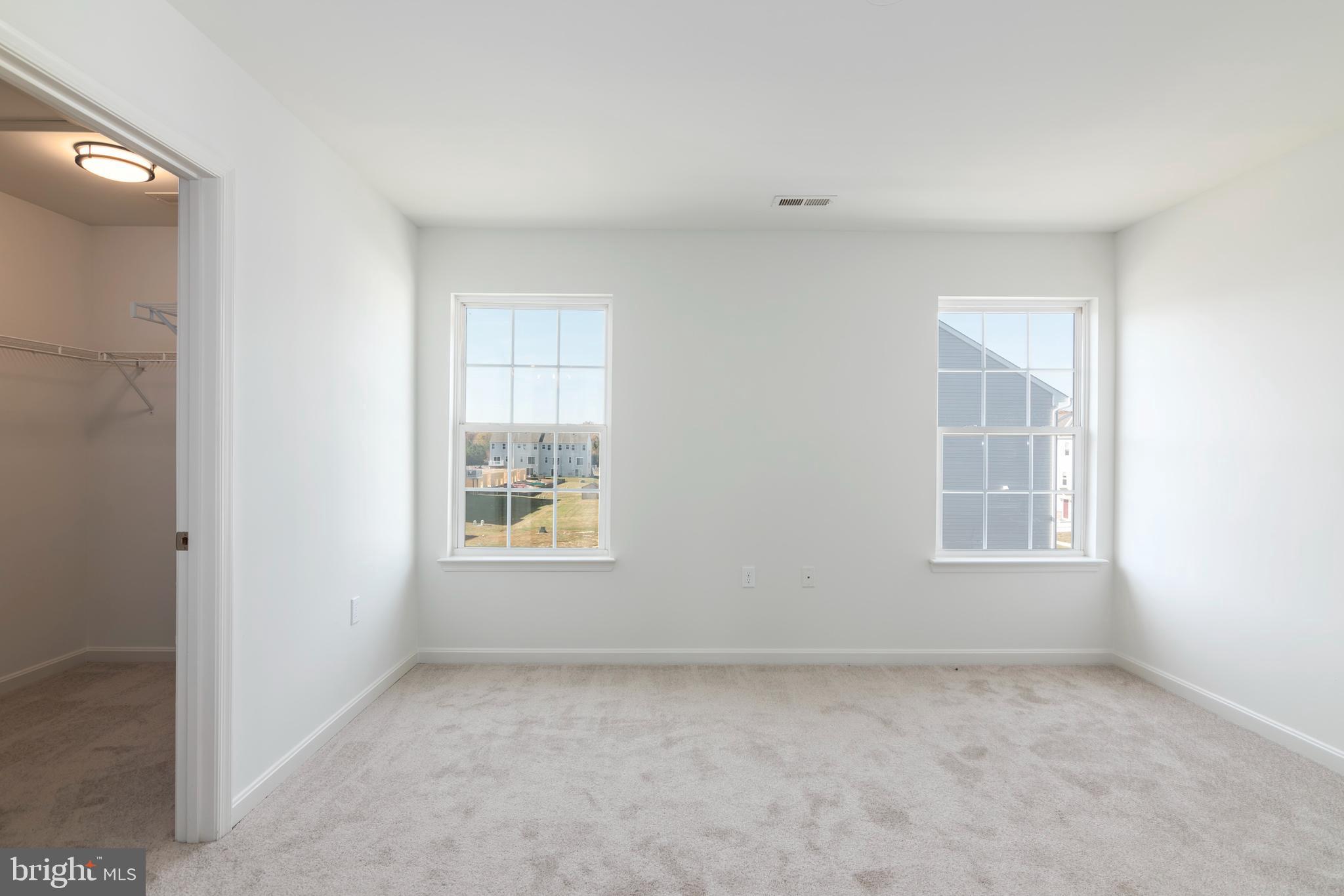 1533 Global Circle Cambridge, MD 21613 - Photo 22 of 27 an empty room with windows