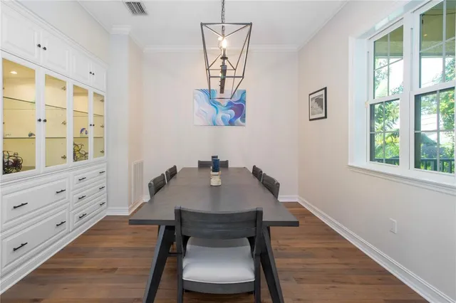 a large kitchen with granite countertop a counter space a sink stainless steel appliances and cabinets