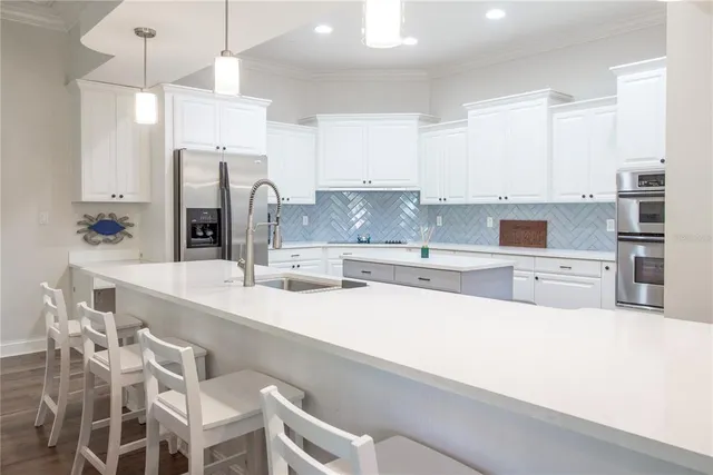 a stove top oven sitting inside of a kitchen
