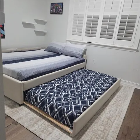 a view of room with workspace and windows