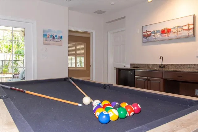 a spacious bathroom with a double vanity sink a mirror and a bathtub