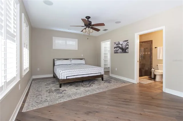 a view of walk in closet and empty room