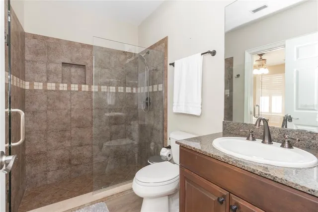 a white toilet sitting next to a window