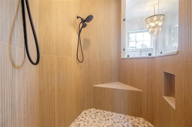 a view of a yard with plants and trees