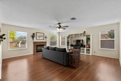 a kitchen with stainless steel appliances granite countertop a sink stove microwave refrigerator and cabinets