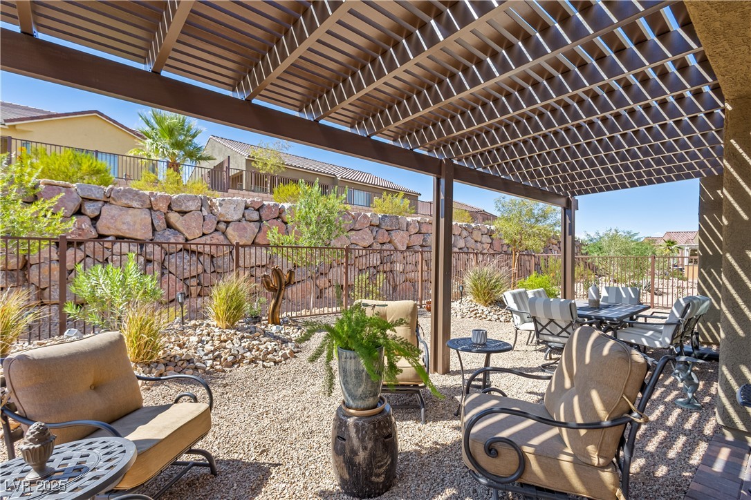 1129 Calico Ridge Mesquite, NV 89034 - Photo 2 of 22 Extended back patio cover with fencing