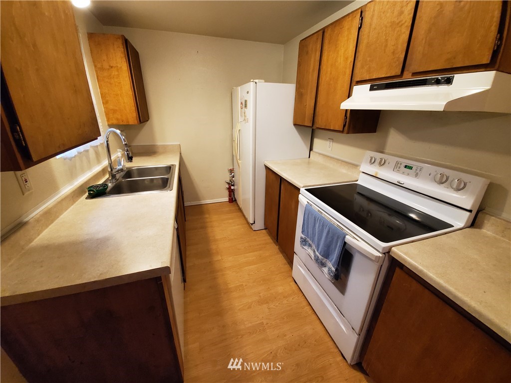 6076 Fazon Road Bellingham, WA 98226 - Photo 15 of 19 a kitchen with a sink a stove and a refrigerator
