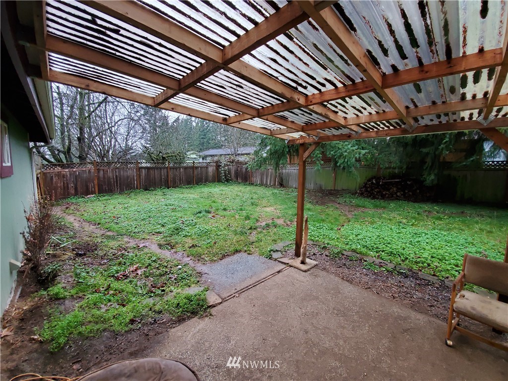 6076 Fazon Road Bellingham, WA 98226 - Photo 16 of 19 a view of a backyard with plants and a patio