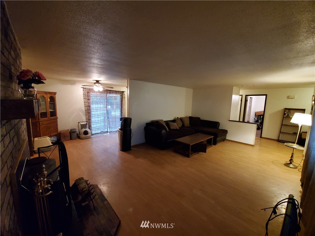 6076 Fazon Road Bellingham, WA 98226 - Photo 7 of 19 a living room with furniture and a flat screen tv