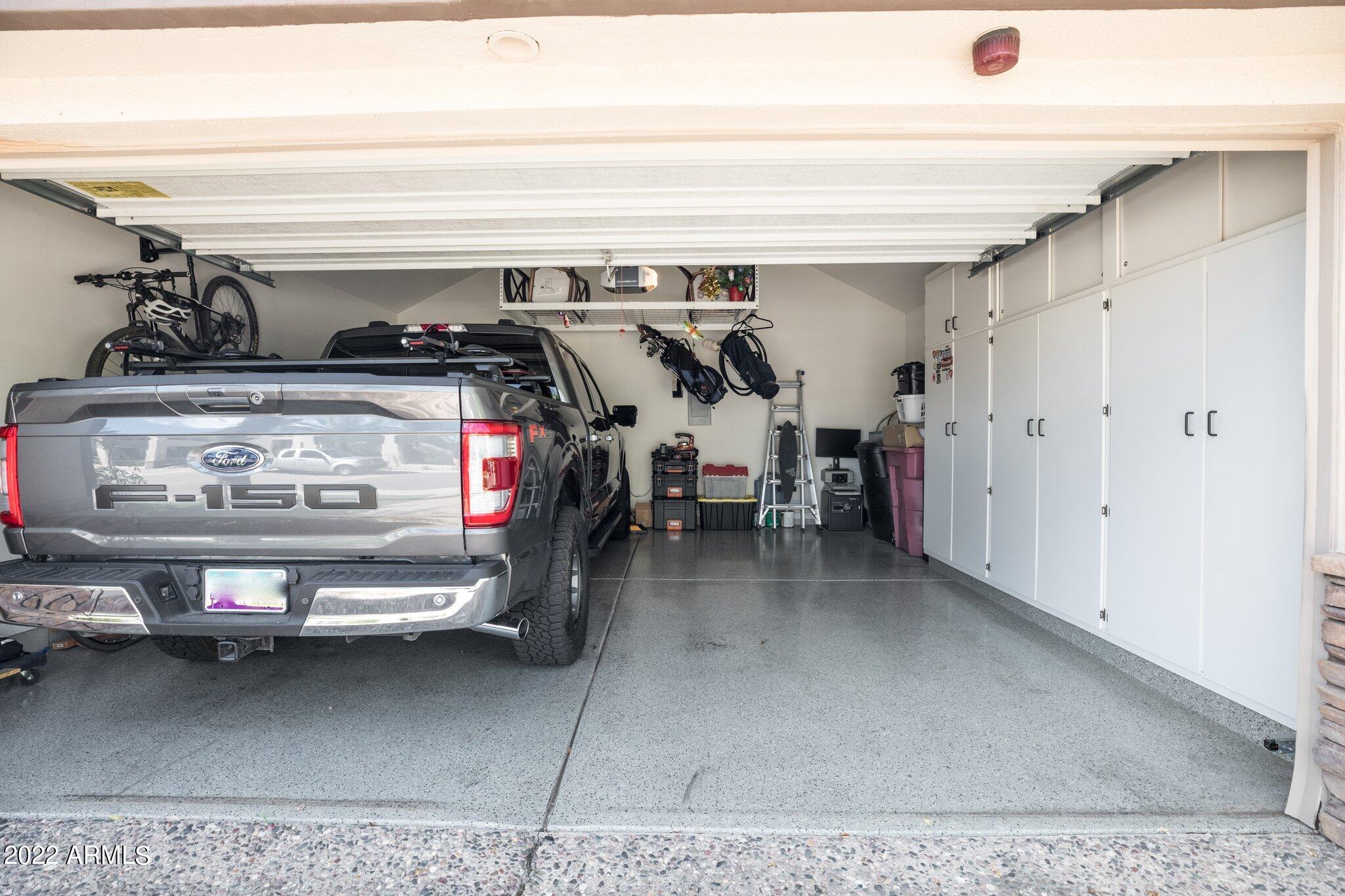 7272 East Gainey Ranch Road, Unit 92 Scottsdale, AZ 85258 - Photo 24 of 38 GARAGE W EXPOXY FLOORS/BUILT IN CABINETS