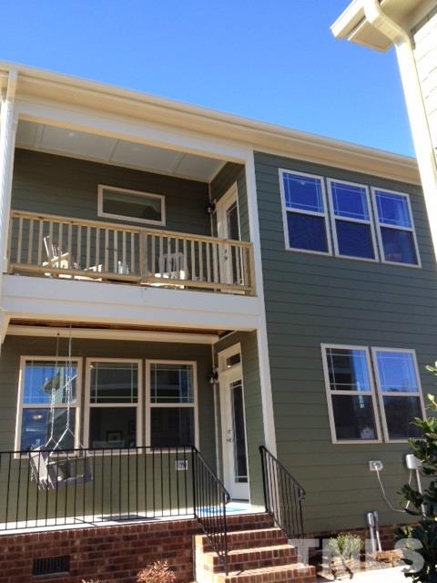 925 Wildflower Ridge Road Wake Forest, NC 27587 - Photo 20 of 24 a front view of a house with balcony