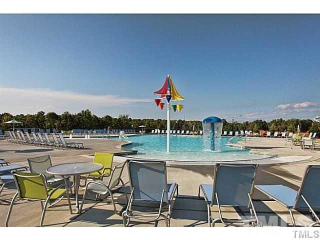 925 Wildflower Ridge Road Wake Forest, NC 27587 - Photo 23 of 24 a terrace with outdoor seating and city view