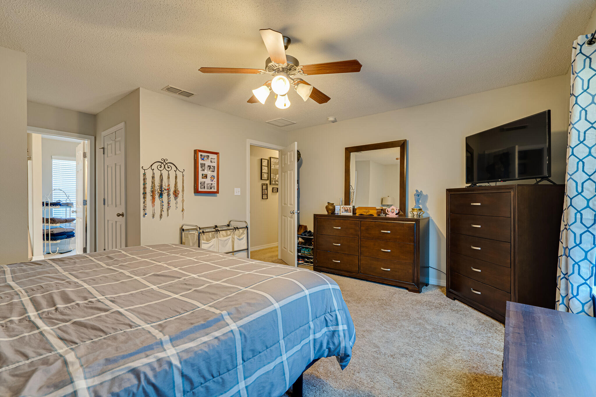 412 Plate Drive Crestview, FL 32539 - Photo 18 of 29 a bedroom with a bed and a dresser