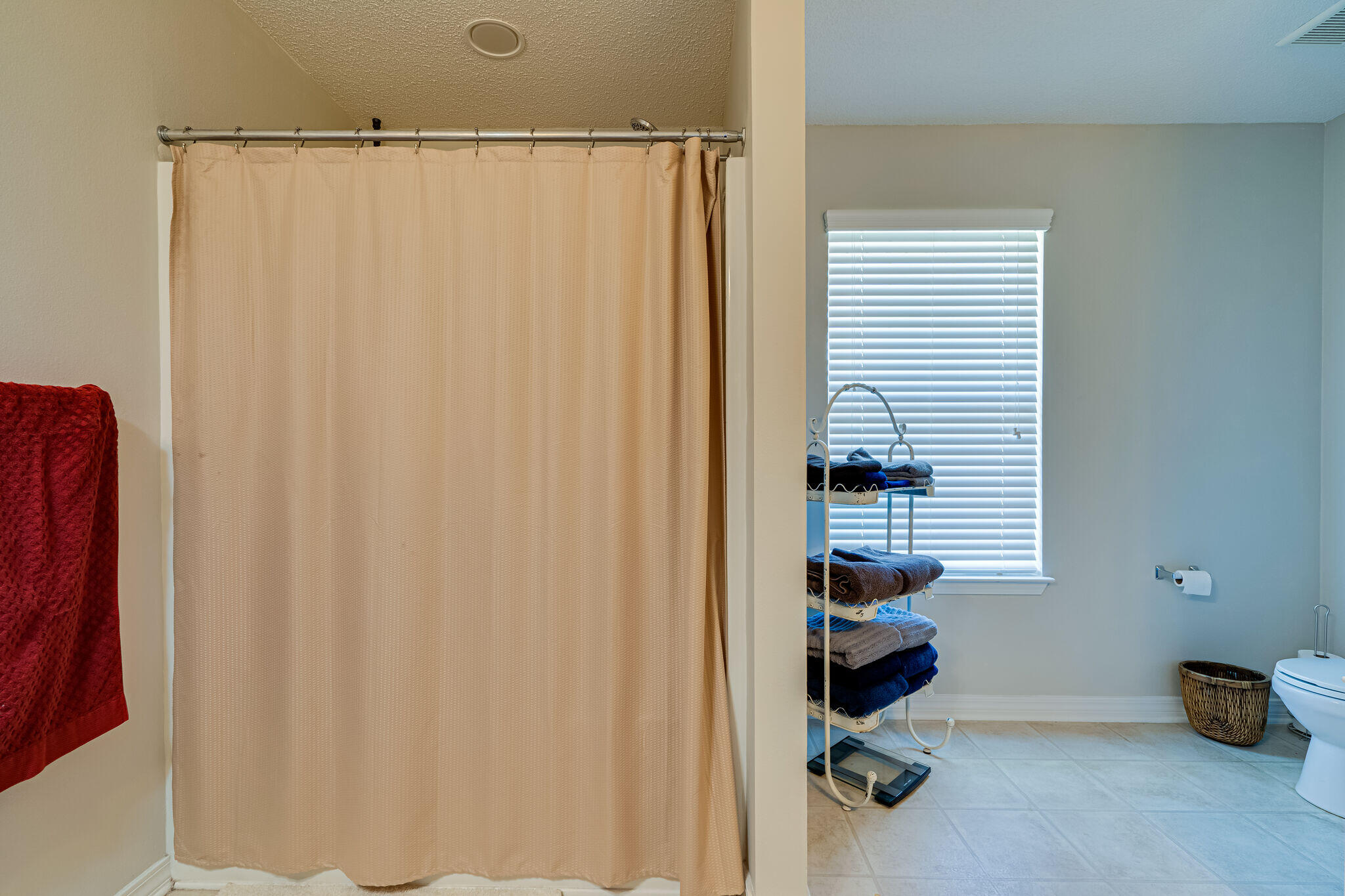 412 Plate Drive Crestview, FL 32539 - Photo 20 of 29 a bathroom with a shower curtain and a window