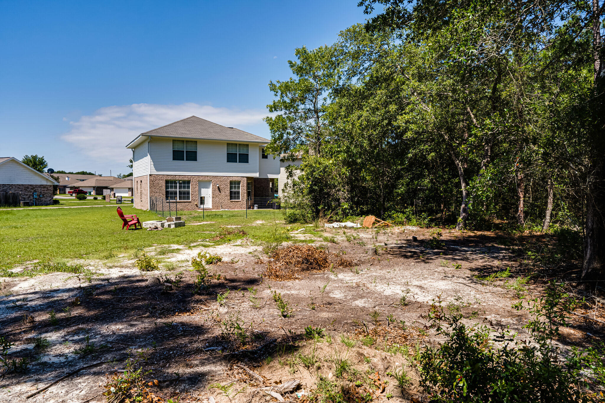 412 Plate Drive Crestview, FL 32539 - Photo 28 of 29 a view of a house with a big yard and large trees