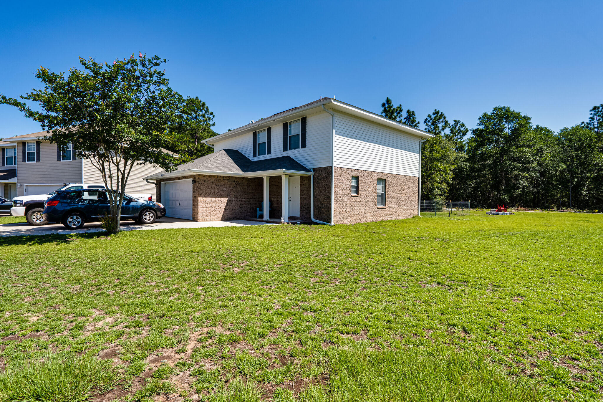 412 Plate Drive Crestview, FL 32539 - Photo 3 of 29 a front view of a house with garden