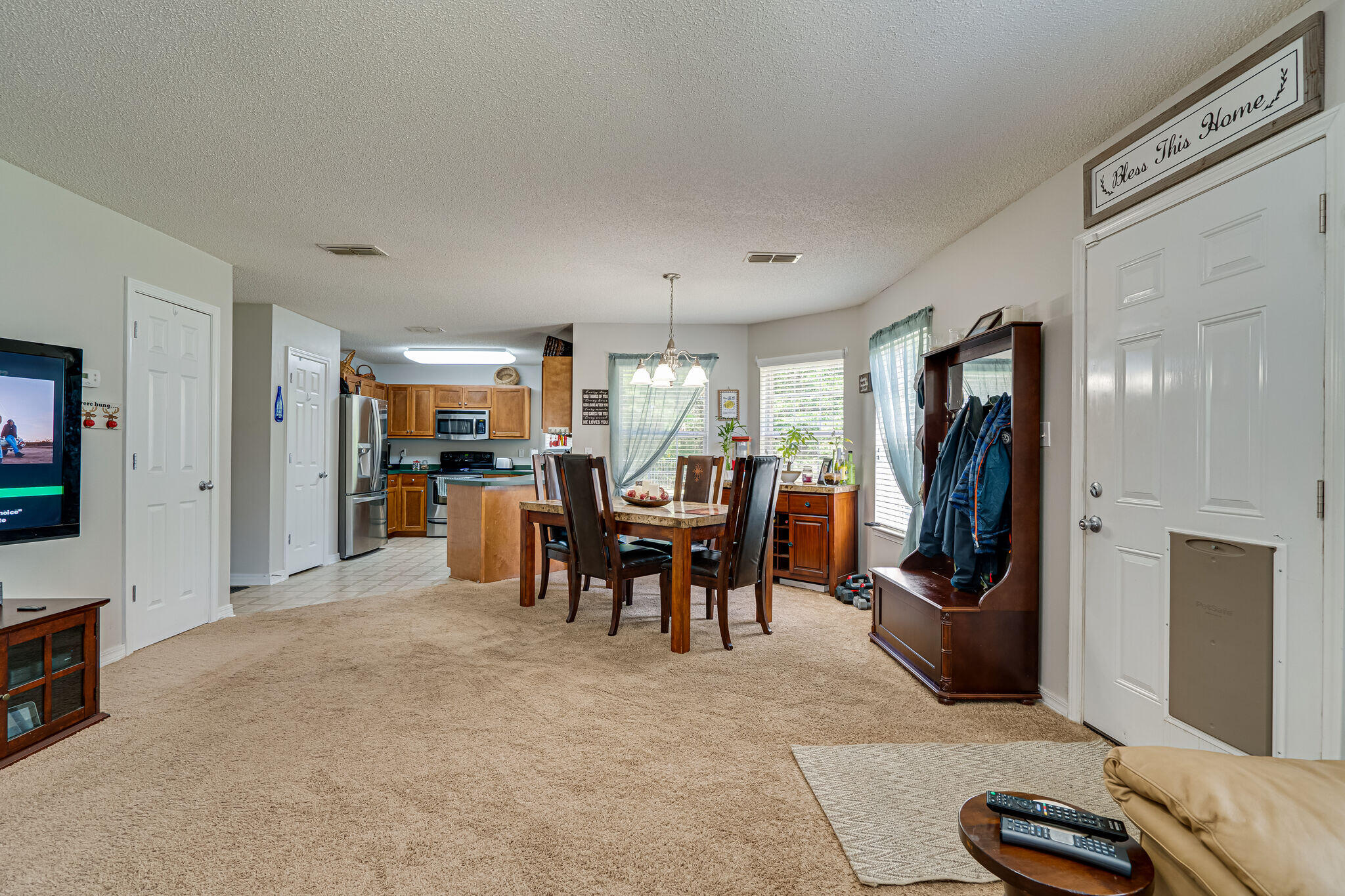 412 Plate Drive Crestview, FL 32539 - Photo 7 of 29 a living room with furniture and a flat screen tv
