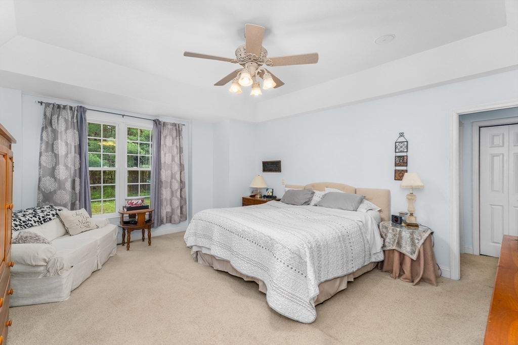 113 Greenwich Plains Road Ware, MA 01082 - Photo 16 of 42 a bedroom with a bed and a large window