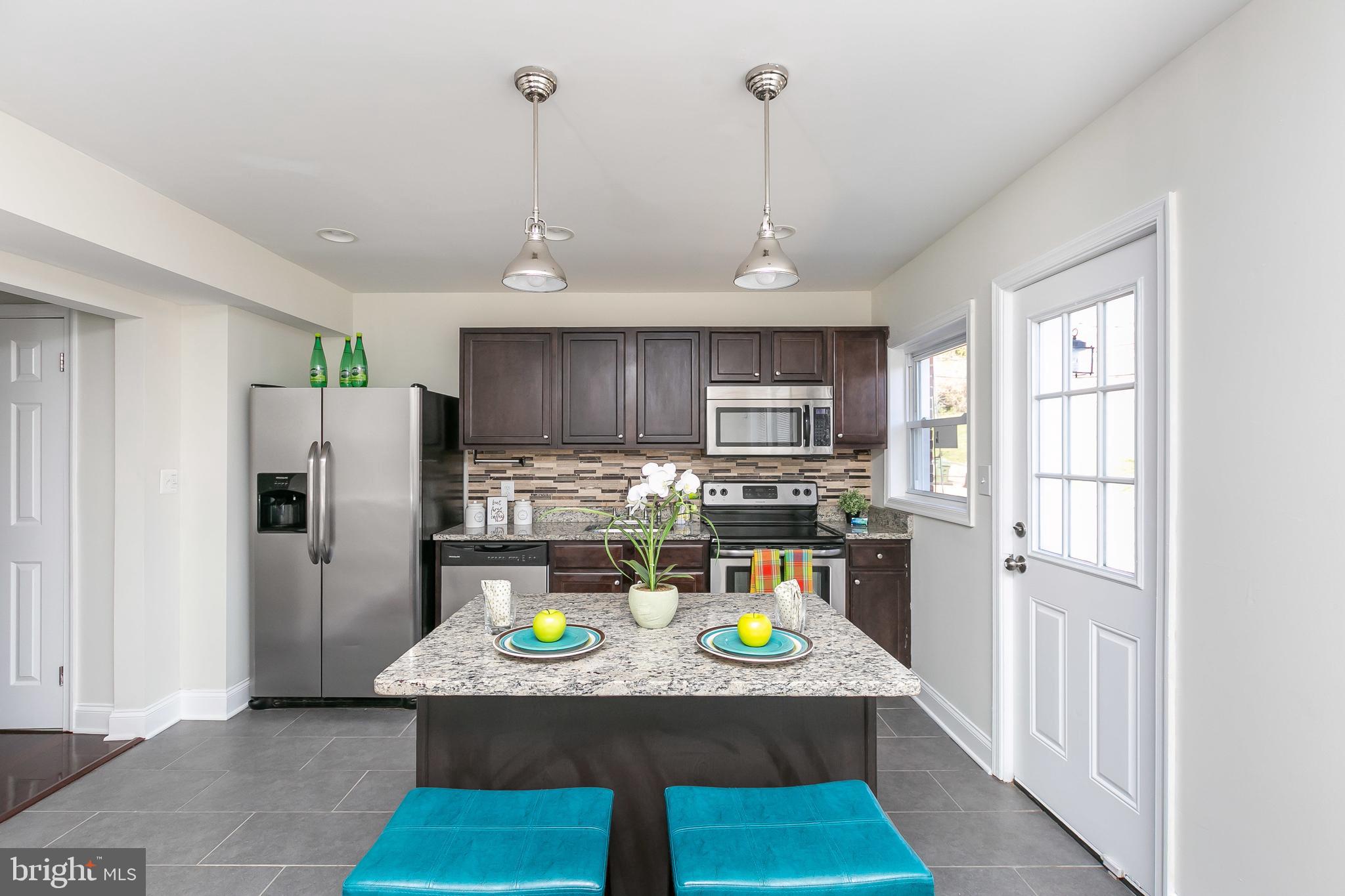 3202 Dorithan Road Baltimore, MD 21215 - Photo 13 of 36 Granite Top Island for Extra Eating & Prep Space