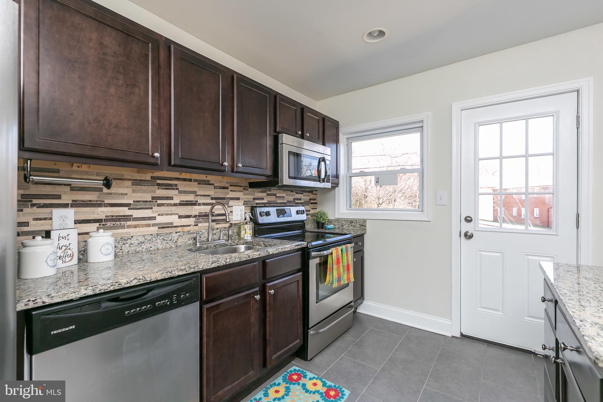 3202 Dorithan Road Baltimore, MD 21215 - Photo 8 of 36 Kitchen with Lots of Updates Granite & Mosaic Tile