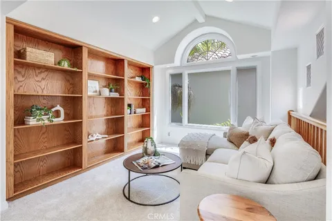 a view of a livingroom with furniture and hardwood floor