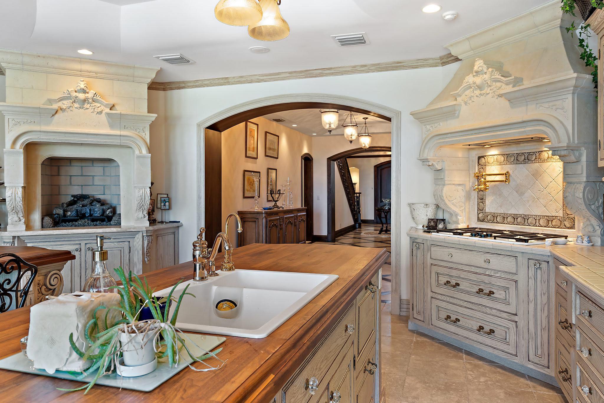 19 North Beach Road Hobe Sound, FL 33455 - Photo 17 of 75 Fireplace, range, island