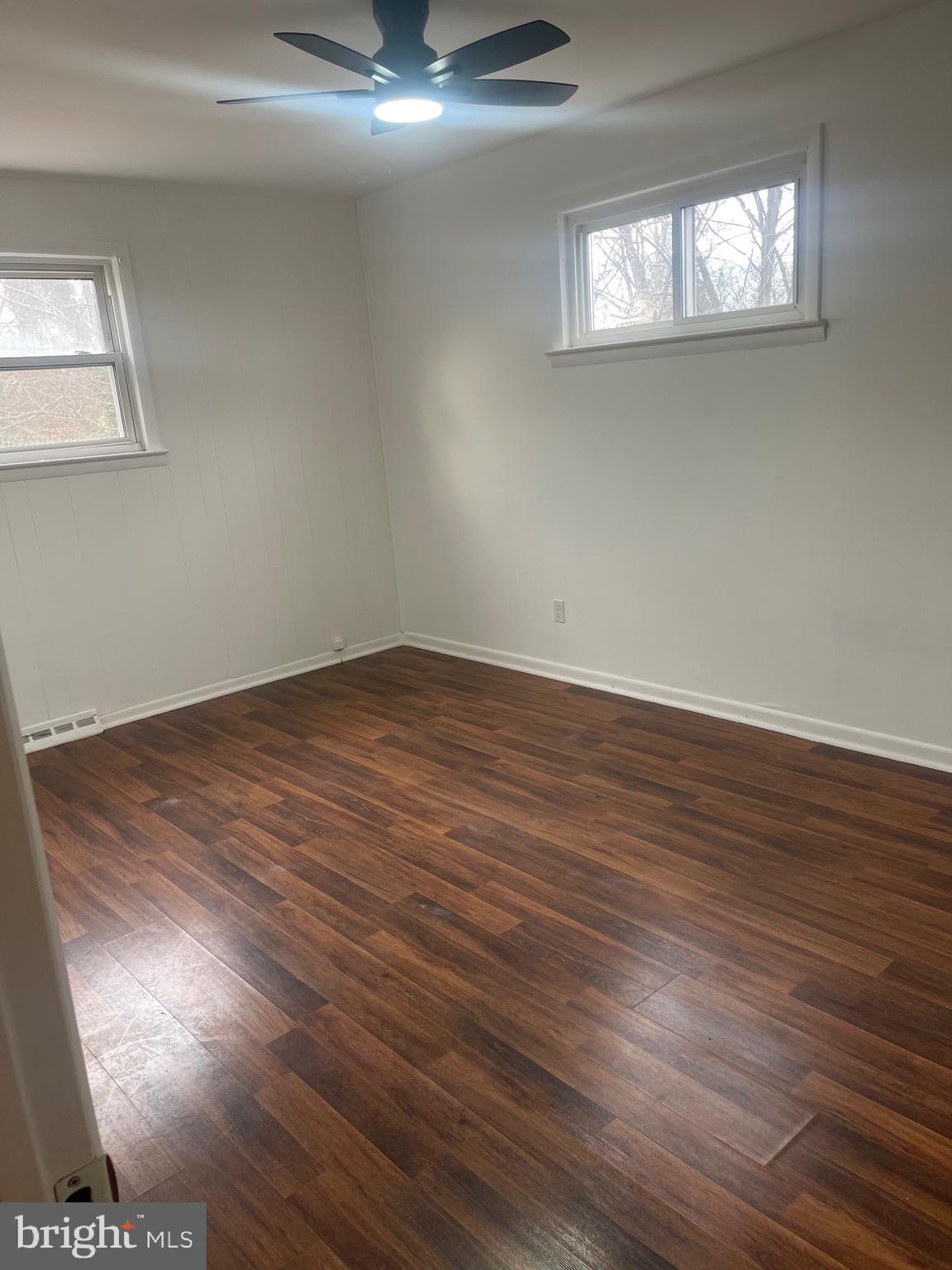 183 Lincoln Road Wenonah, NJ 08090 - Photo 12 of 19 wooden floor in an empty room with a window