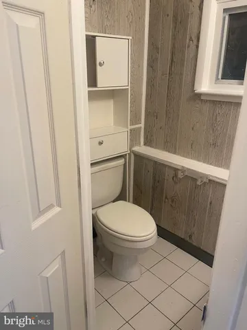 a bathroom with a toilet and a sink