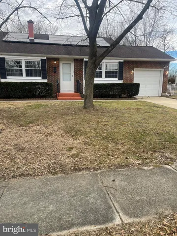a front view of a house with yard