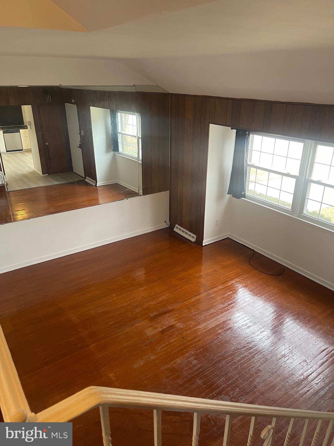 183 Lincoln Road Wenonah, NJ 08090 - Photo 4 of 19 an empty room with wooden floor and windows