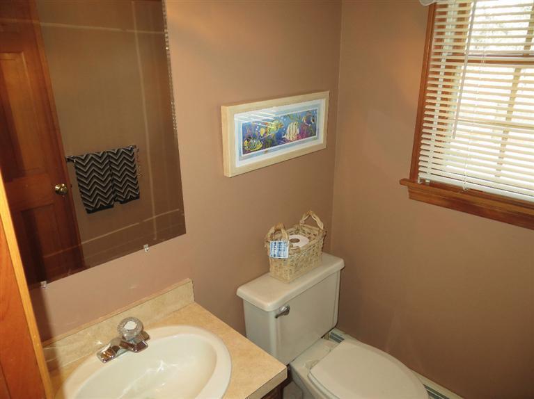 1145 Herring Brook Road Eastham, MA 02642 - Photo 8 of 34 a bathroom with a sink mirror and toilet