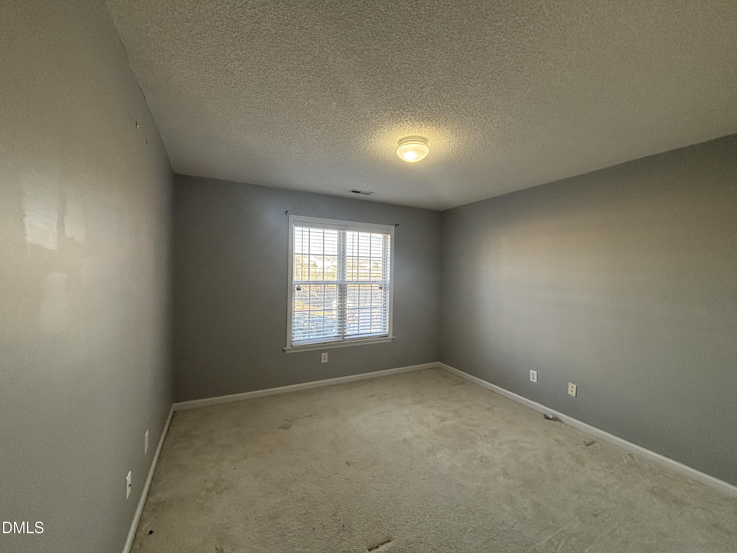 1704 Crag Burn Lane Raleigh, NC 27604 - Photo 11 of 22 an empty room with a window