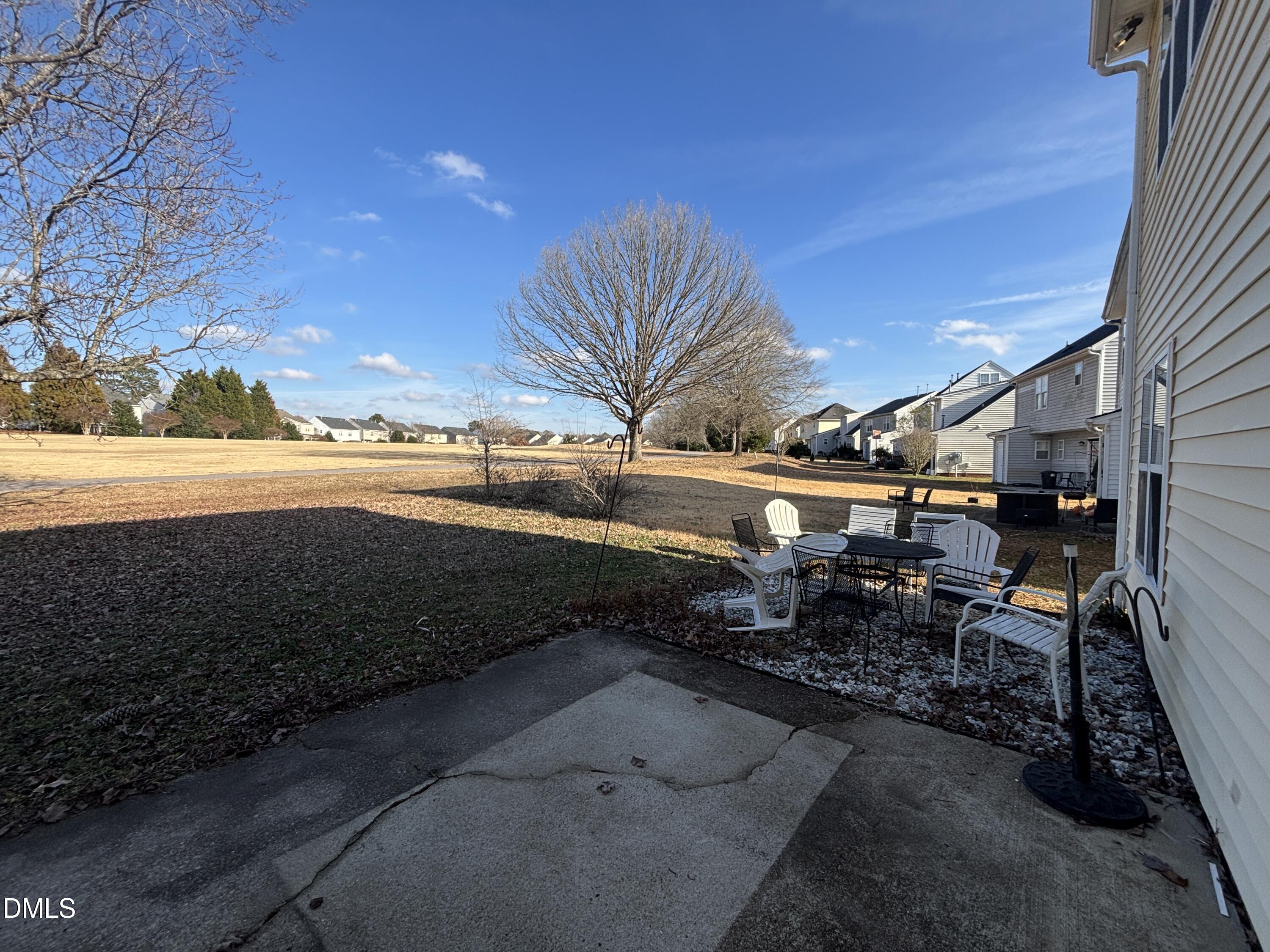 1704 Crag Burn Lane Raleigh, NC 27604 - Photo 7 of 22 a view of a backyard with table and chairs
