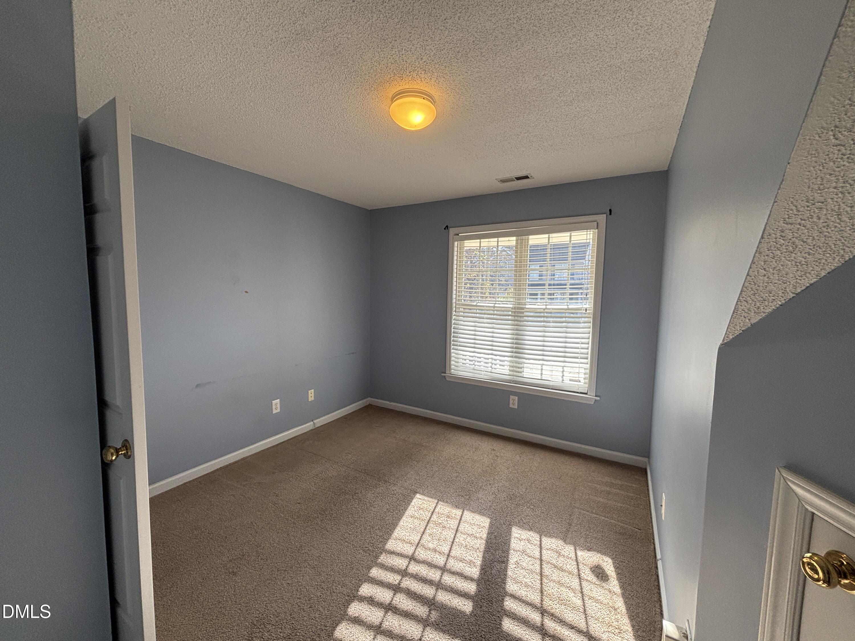 1704 Crag Burn Lane Raleigh, NC 27604 - Photo 8 of 22 a view of an empty room with a window