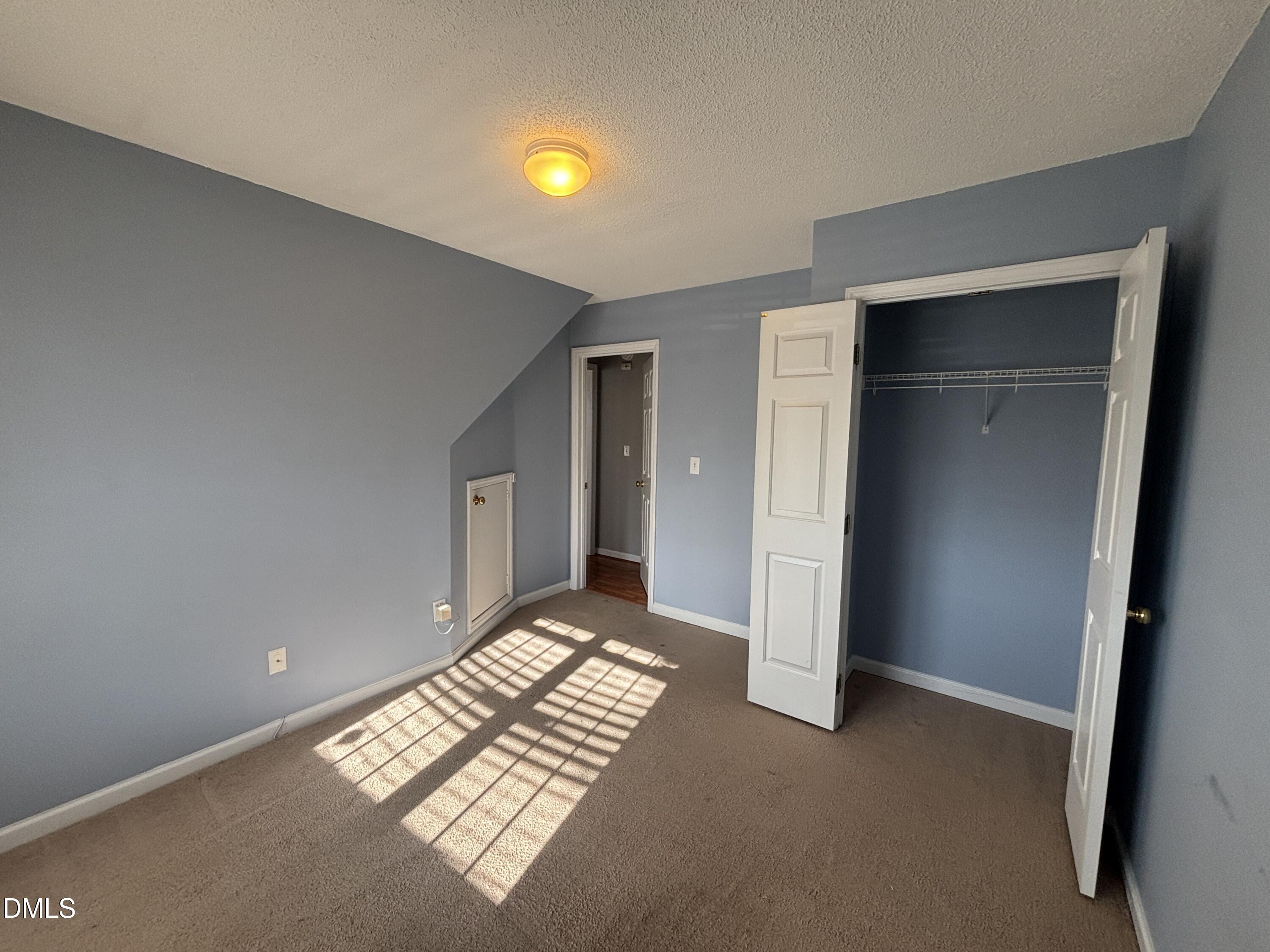 1704 Crag Burn Lane Raleigh, NC 27604 - Photo 9 of 22 an empty room with windows