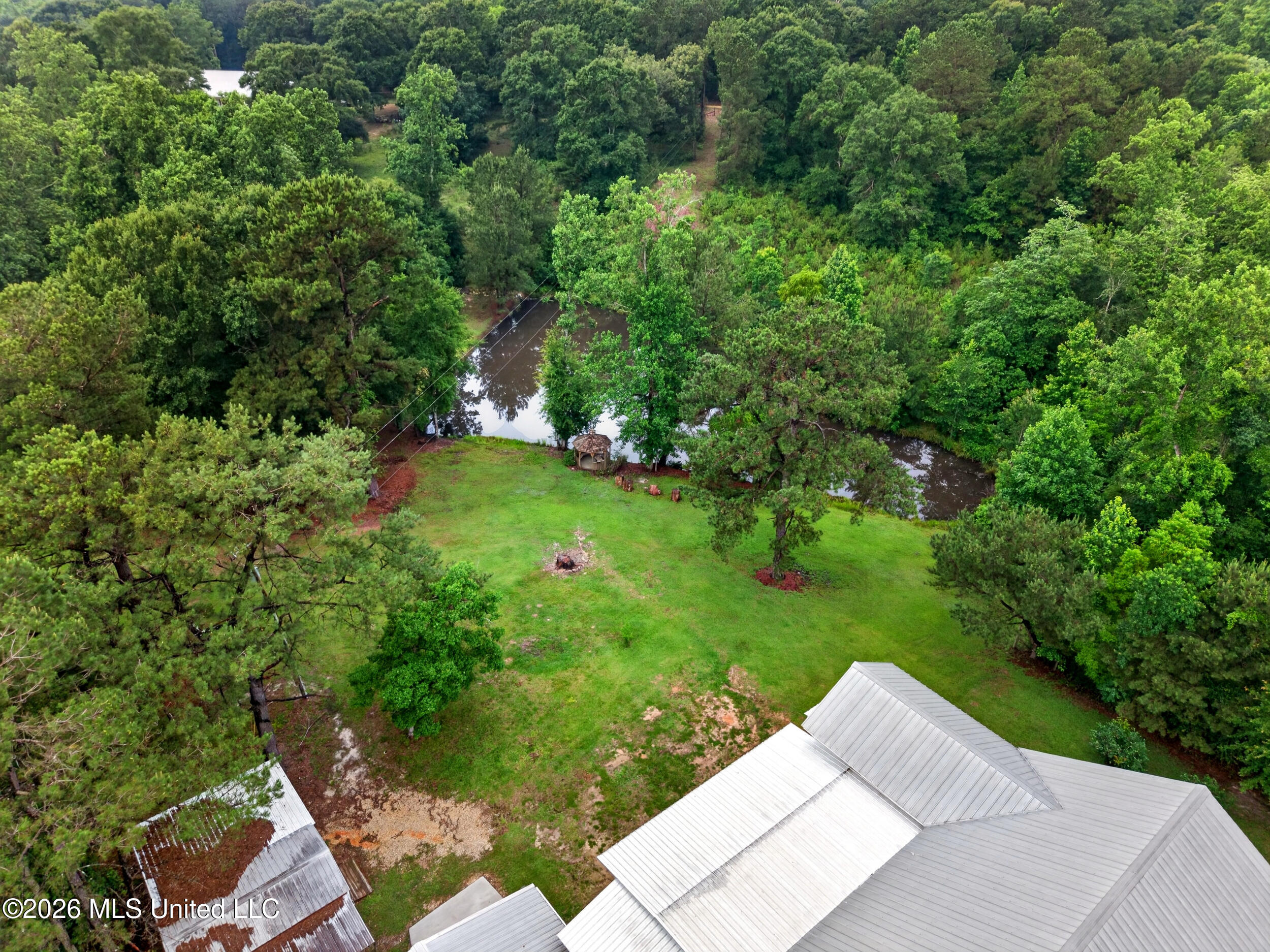 219 Pop Hill Road, Unit B Poplarville, MS 39470 - Photo 58 of 74 58_58_backyard_pond