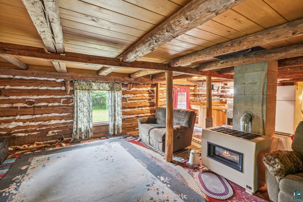 55675 Ashland Bayfield Road Mason, WI 54856 - Photo 4 of 26 Misc room featuring beamed ceiling, log walls, and wood ceiling