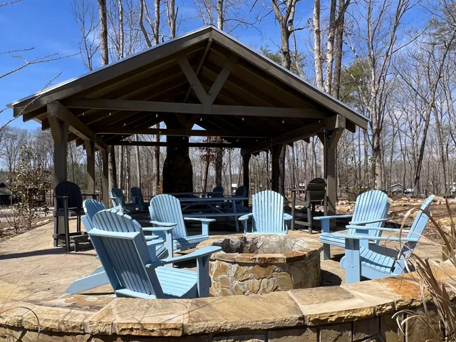 a patio with patio lots of furniture and umbrella